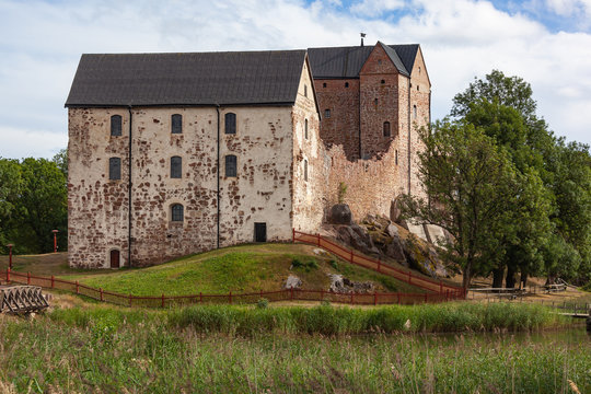 Medieval Kastelholm Castle (built in 14th century) on the hill on the shore of fjord,  Aland islands, Finland