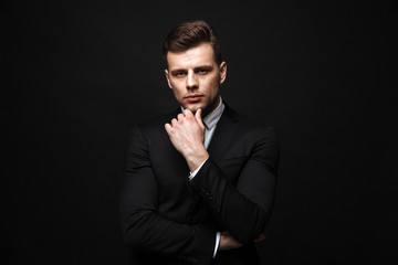 Fototapeta premium Handsome confident businessman wearing suit