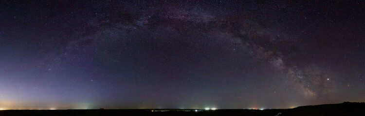 Panoramic view of the Milky Way. Bright stars of the night sky. Astrophotography with a long exposure.