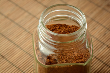 Jar of instant coffee on table