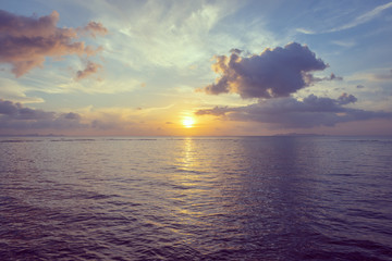 Rain clouds over beautiful tropical beach seascape in summer season