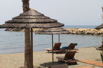 Beach with sun beds and umbrellas