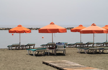 Beach with sun beds and umbrellas