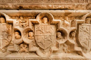 Relief on tomb of Fernando I with scenes of life and symbols of the country. Many ancient artworks...
