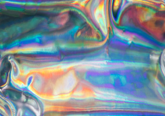 Fototapeta na wymiar Holographic iridescent abstract blurred surface. Holographic gradient.