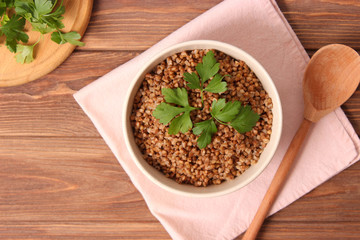 boiled buckwheat in a plate on the table.