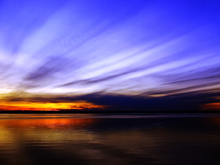Beautiful sunset sky above clouds with dramatic light.