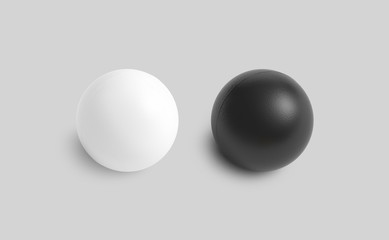 Blank black and white stress ball mockup, top view isolated, 3d rendering. Clear soft balloon for exercise in hand. Clean round antistress bal. Empty relay and rubber sphere from worry template.