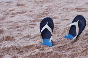 Sandal on the sand sea beach