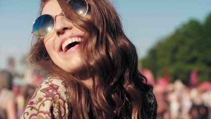 Joyful woman dancing at the music festival 