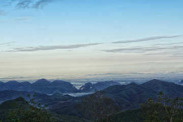 Fototapeta premium Sea of the mist with blue sky on mountain at morning sunrise winter season background