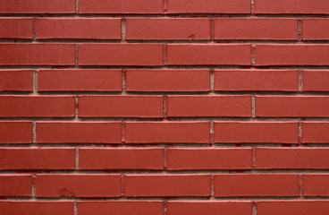 Obraz premium The unique texture of a modern brick wall of a terracotta brick house.