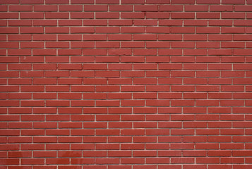 Fototapeta na wymiar The unique texture of a new terracotta brick wall of a stone house