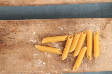 pasta raw feathers on colorful background