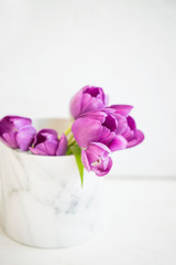 Purple tulips bouquet in vase still life