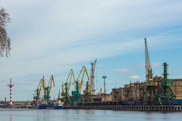 Obraz premium industrial port with containers. crane
