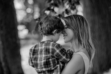 Fototapeta premium mother holds son on a hands at outdoor