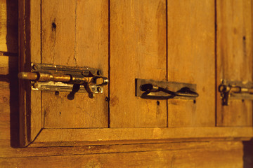 Old lock on an old wooden door in an abandoned house in the medieval town of Monemvasia....