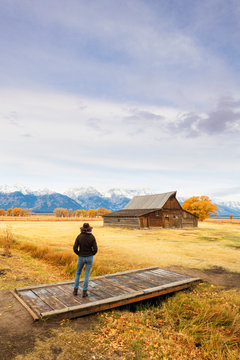 Woman at Mormon Row and Teton Range, Grand Teton National Park, Wyoming