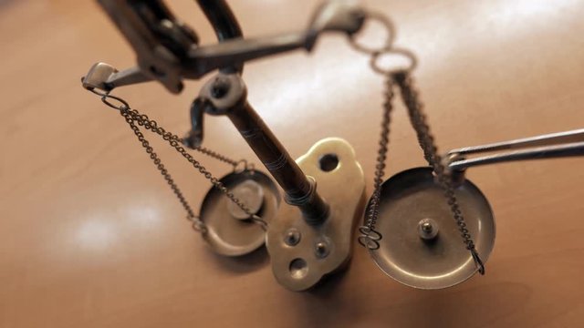 close-up of a scale weighing a coin