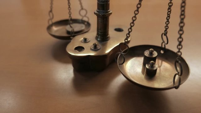 close-up of a scale weighing a coin