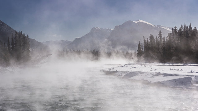 Mist rising off the waters of the Bow River in sub-zero winter weather, Canmore, Alberta, Canadian Rockies, Canada