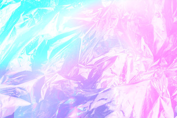 vaporwave style holographic texture background: neon pink funky paint texture. Close up, flat lay.