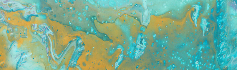 photography of abstract marbleized effect background. Blue, mint and white creative colors. Beautiful paint with the addition of gold.