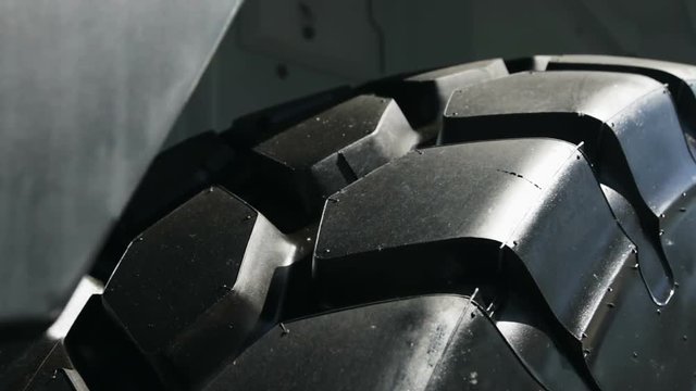 large tires with deep treads mounted on a tractor, dump truck or bulldozer