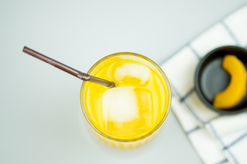 Freshly squeezed sweet orange juice with ice cubes