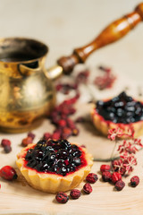 Sweet cupcakes with fresh organic strawberries on the table
