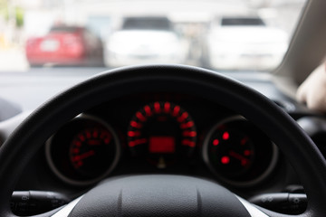 Blurred background with Modern Car dashboard modern automobile control illuminated panel.Car...