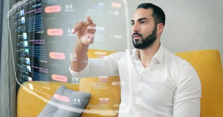 Handsome bearded asian man using futuristic hologram touchscreen with swipe gestures control, domestic future internet browser - Powered by Adobe