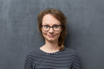 Portrait of cute smiling girl with eyeglasses