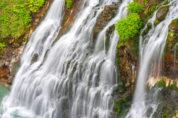 Shirahige-no-taki Waterfalls and the Tokachi river in Biei, Hokkaido, Japan
