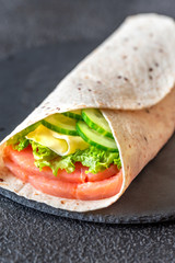 Tortilla wrap with salmon and vegetables
