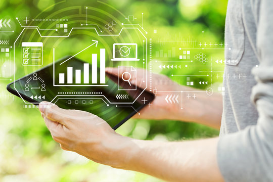 Marketing concept with young man holding his tablet computer outside - Powered by Adobe