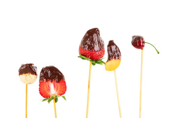 chocolate covered food on fondue stick
