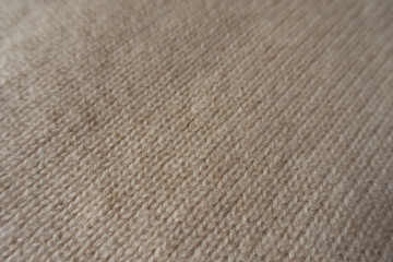 Diagonal view of simple handmade knitted fabric