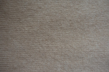 View of simple beige knitted fabric from above