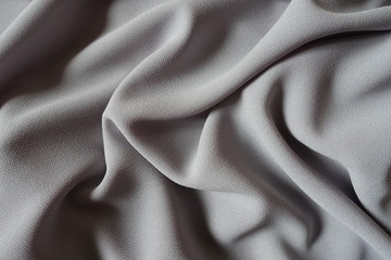 Crumpled grey crepe georgette fabric from above
