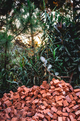 Pile of traditional red bricks at a construction site in Dalat, Vietnam