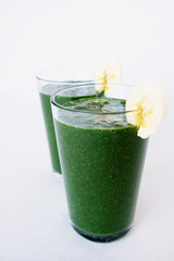 Fresh green kale, banana, coconut milk, spirulina powder and flax seeds smoothie. Healthy lifestyle, vegan food