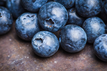 Ripe blueberries on the rustic background. Selective focus. 