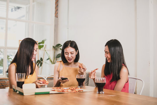 Group Of Asian Women Tanager Eating Pizza And Talking Funny, Food Party At Home