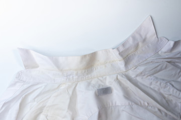 yellow dirty stain on white collar shirt