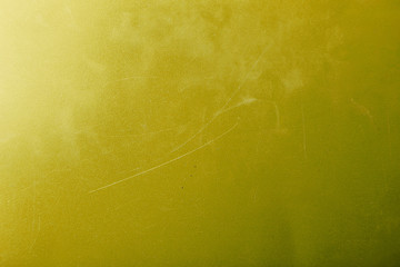 Bright abstract dirty yellow texture with scratches and scuffs