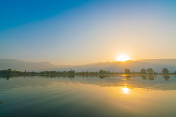 Naklejka premium Sunrise on Dal lake, Kashmir India .