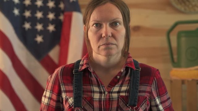 Portrait of confident serious american female farmer