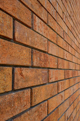 Brick wall of old cracked brick